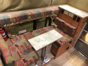 Dinette with their custom choice of fabrics and cabinetry stain