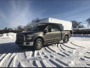 slide-in camper on snow