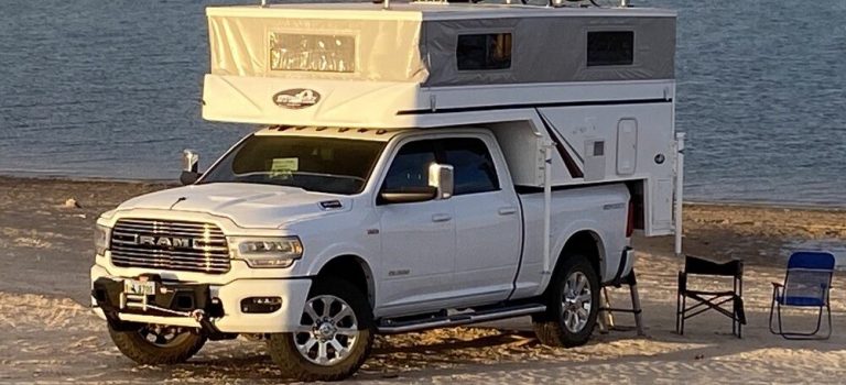 A pop up camper set up in a scenic outdoor location, perfect for modern professionals.